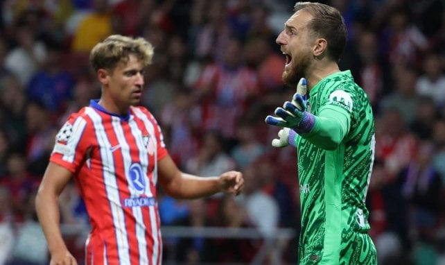 Jan Oblak levanta los brazos