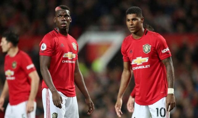 Paul Pogba, junto a Marcus Rashford